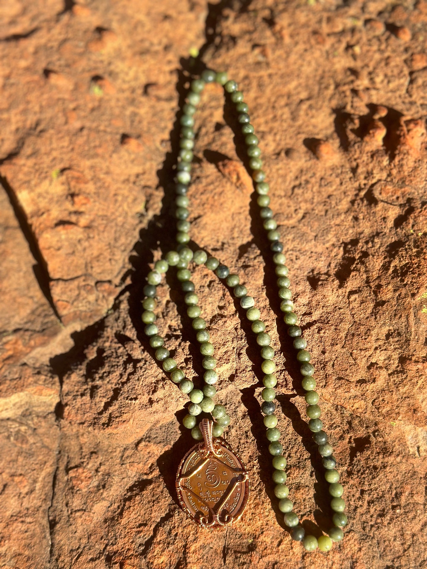 Amulet on Crystal Necklace